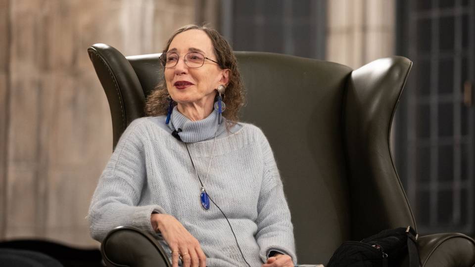Joyce Carol Oates in a chair