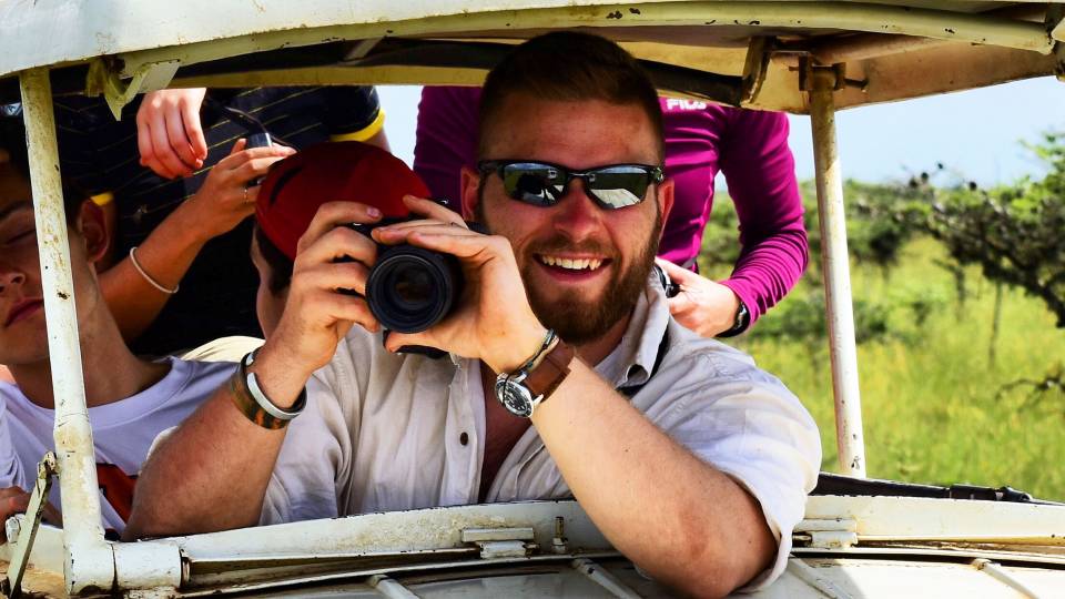 Daniel Petticord holding a camera