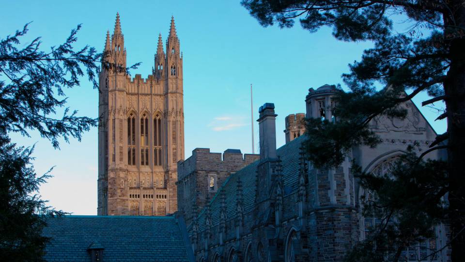 Tower of graduate school against a blue sky