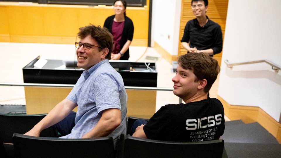 A class listens to a presentation