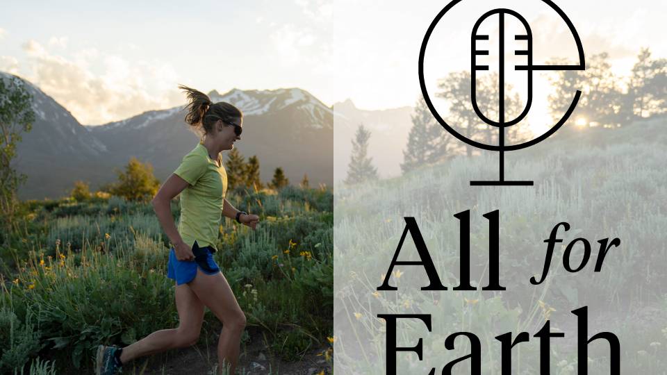 A woman runs up a hill at sunrise