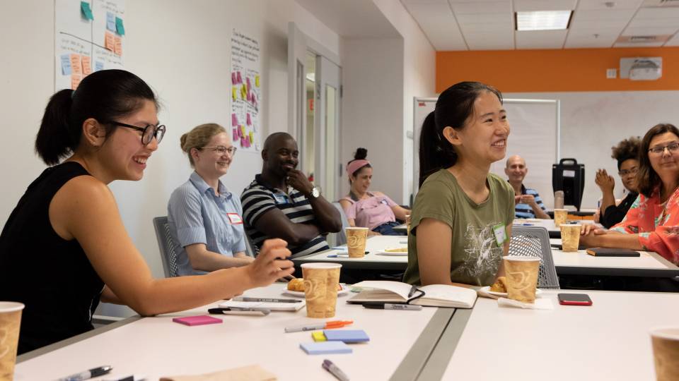 Students laugh during a group discussion