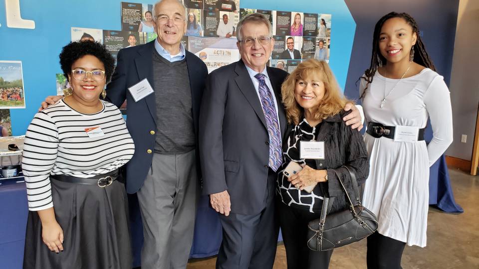 Michael Gage and Gary Hoachlander pose with students and staff