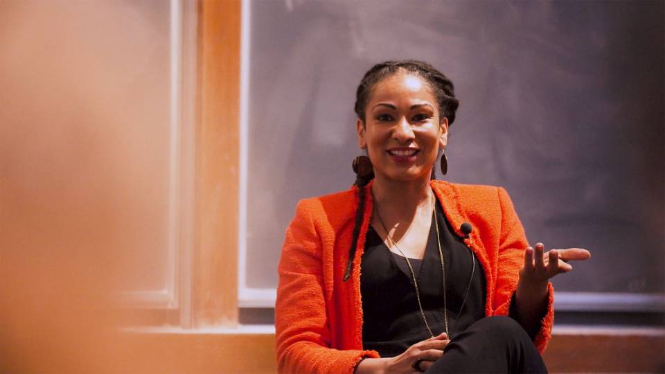 Ruha Benjamin speaks in front of a group