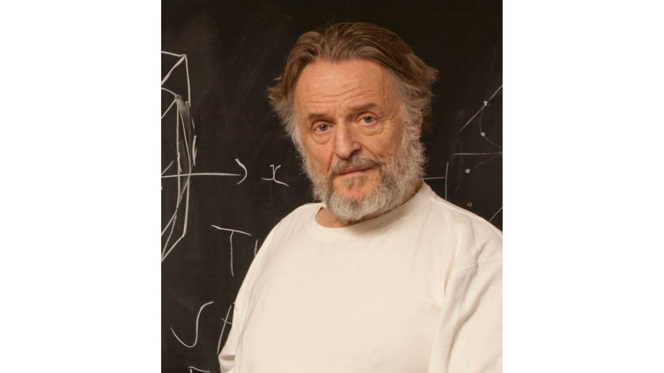 John Conway in front of a blackboard