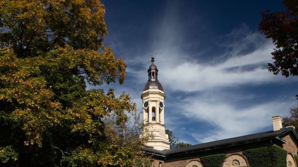 Nassau Hall  with white clouds and blue sky behind