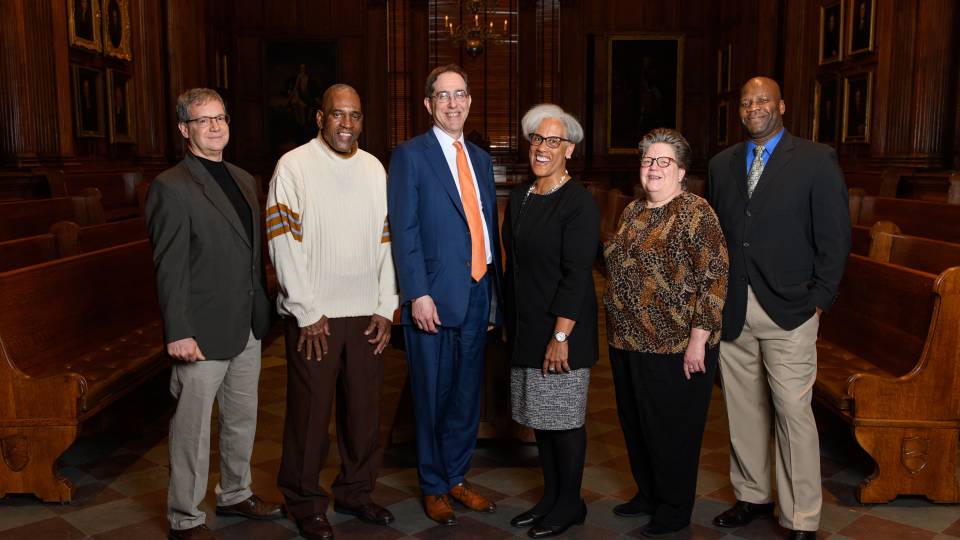 President Eisgruber poses with outstanding staff members honored for their service