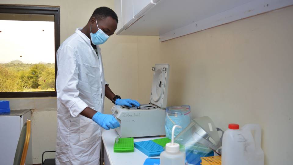 researcher with a centrifuge