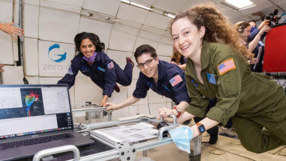 People floating in a weightless environment