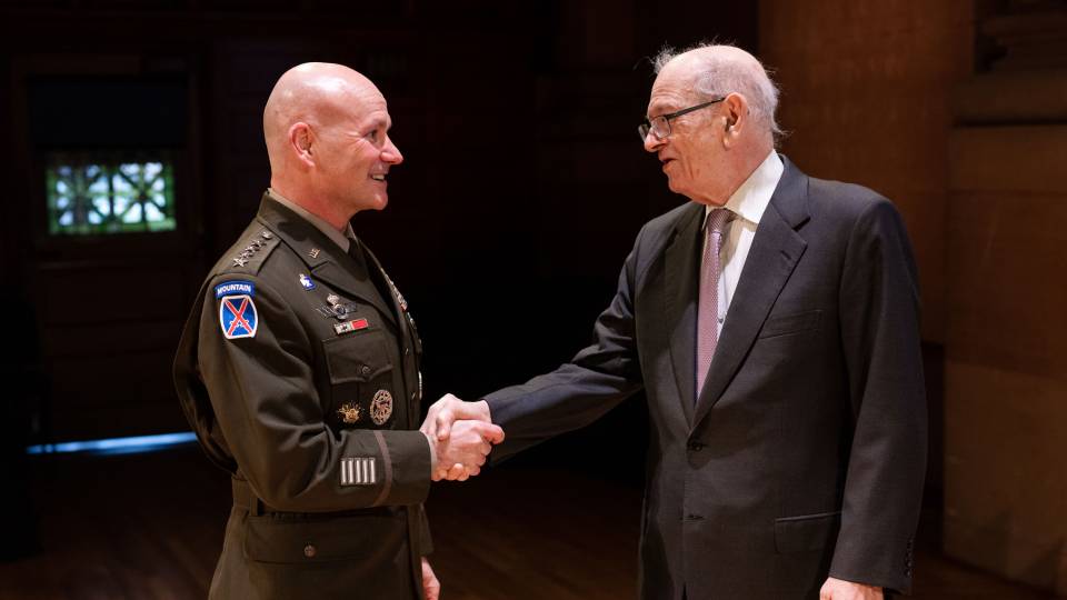 Cavoli and Kahn shaking hands