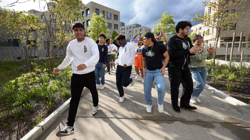 Students and Kwanza Jones dance to dedication ceremony