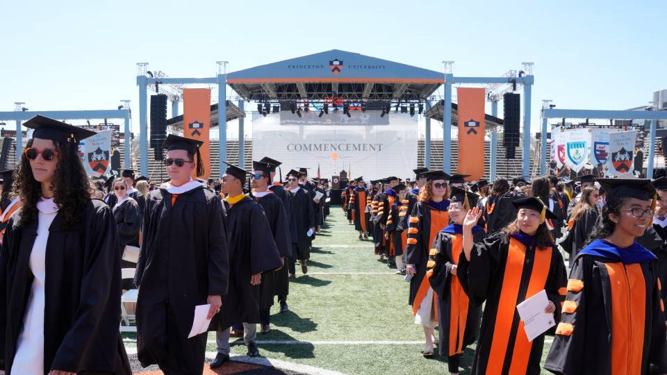 Graduating students in front of the stage