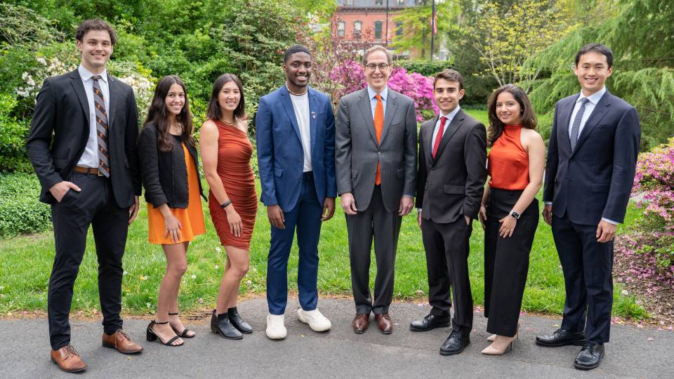 This year's winners of the Spirit of Princeton Award flank Predisent Eisbruber