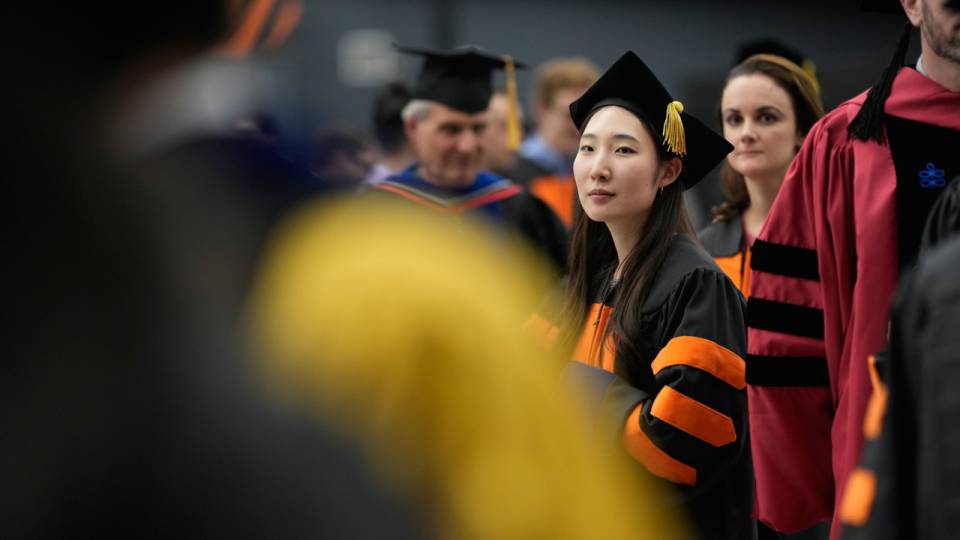 Lady in graduation attire.