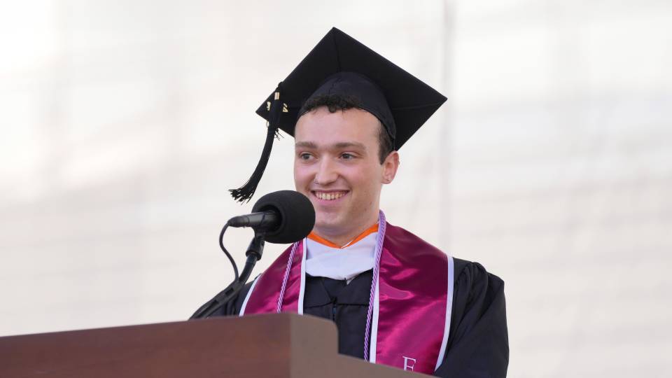 John Freeman smiling behind a podium