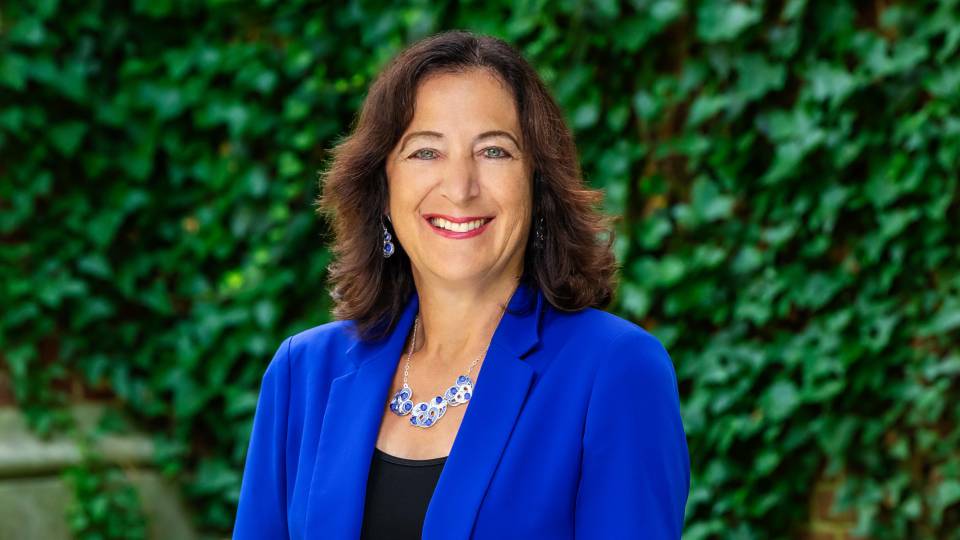 Andrea Goldsmith wearing a blue blazer.