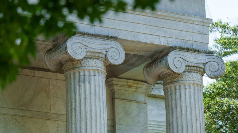 Doric columns and summer leaves on campus