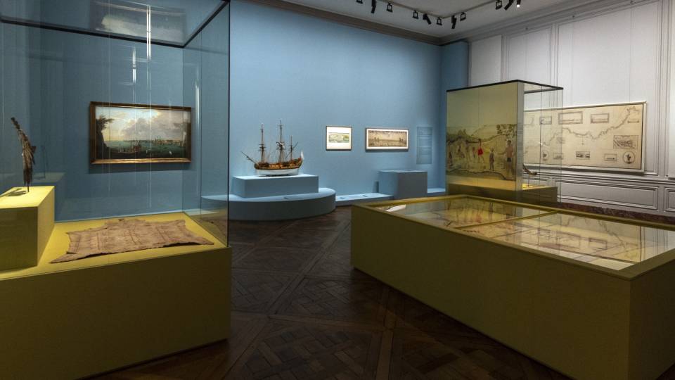 An interior shot of the Versailles exhibit shows Native and French artwork in dialogue with each other