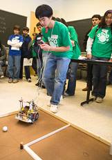 Student guiding a robot
