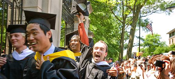Graduates marching through the gates