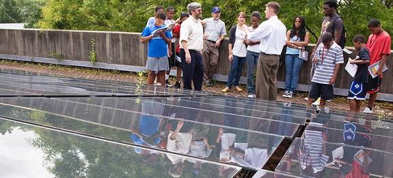group on deck with panels