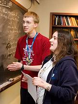 at the chalkboard in the linguistics club