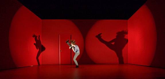 High kick casting shadows on stage