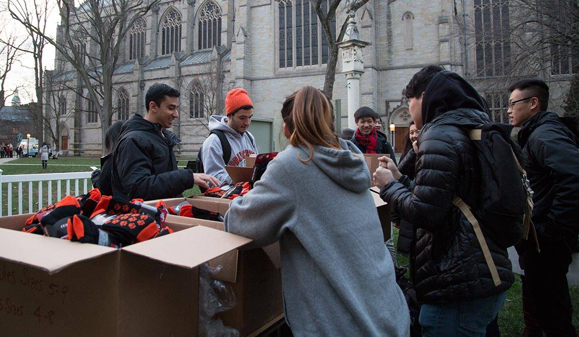 Reading Period Dean's Date handing out socks