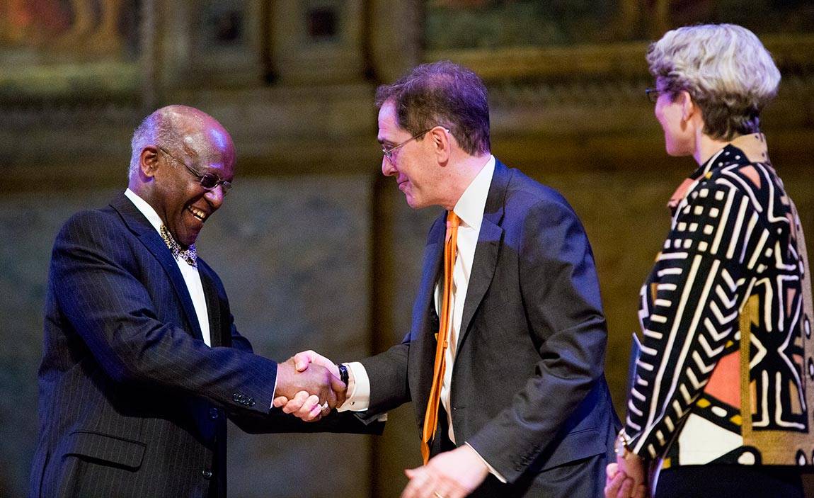 Chris Eisgruber and Wesley Harris shake hands