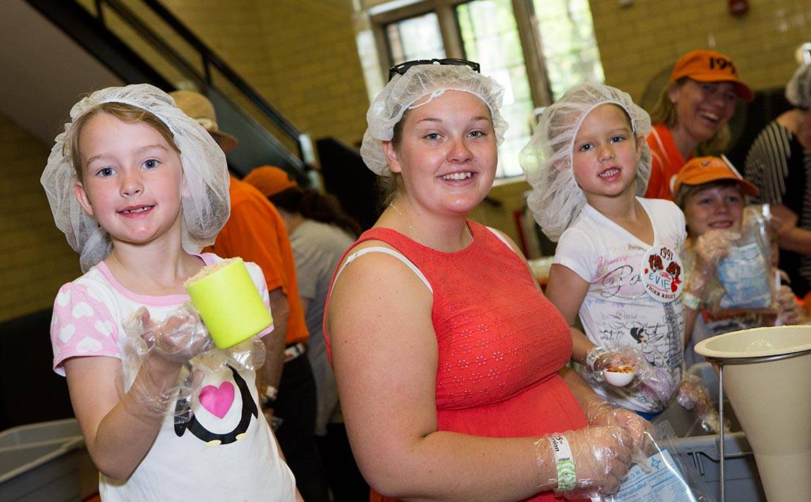 Reunions 2016 Violet Schumacher, Felicia Fahlstrom and Evelyn Schumacher help pack food at the Kids Against Hunger Coalition