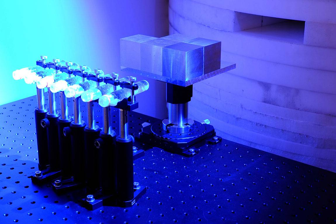 Setup of Sébastien Philippe’s experiment in a PPPL laboratory. Neutrons beamed from the device at right passed through the arrangement of cubes and were recorded in the bubble detectors at left.