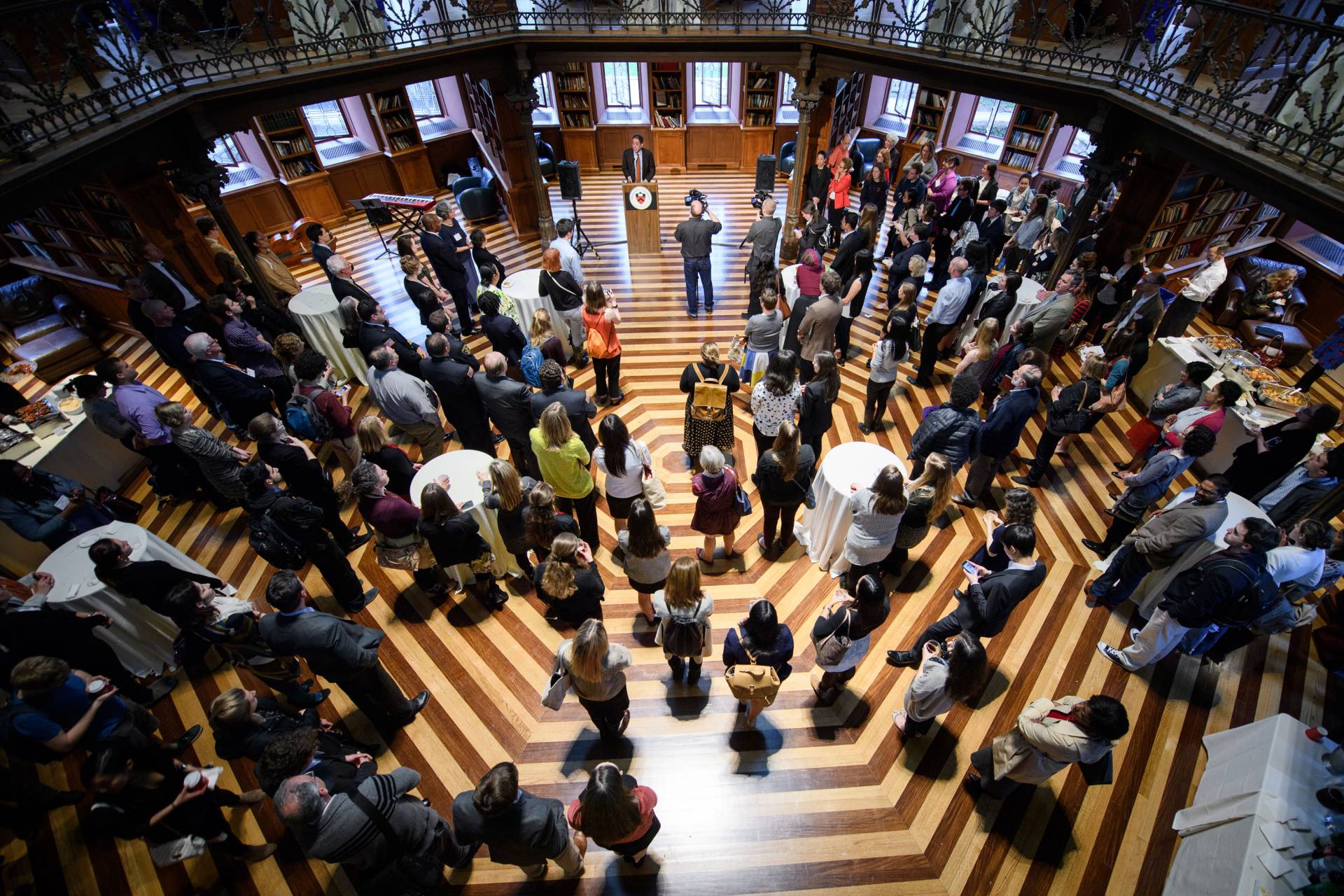 Crowd stands and listens as Christopher L. Eisgruber speaks during Service Celebration