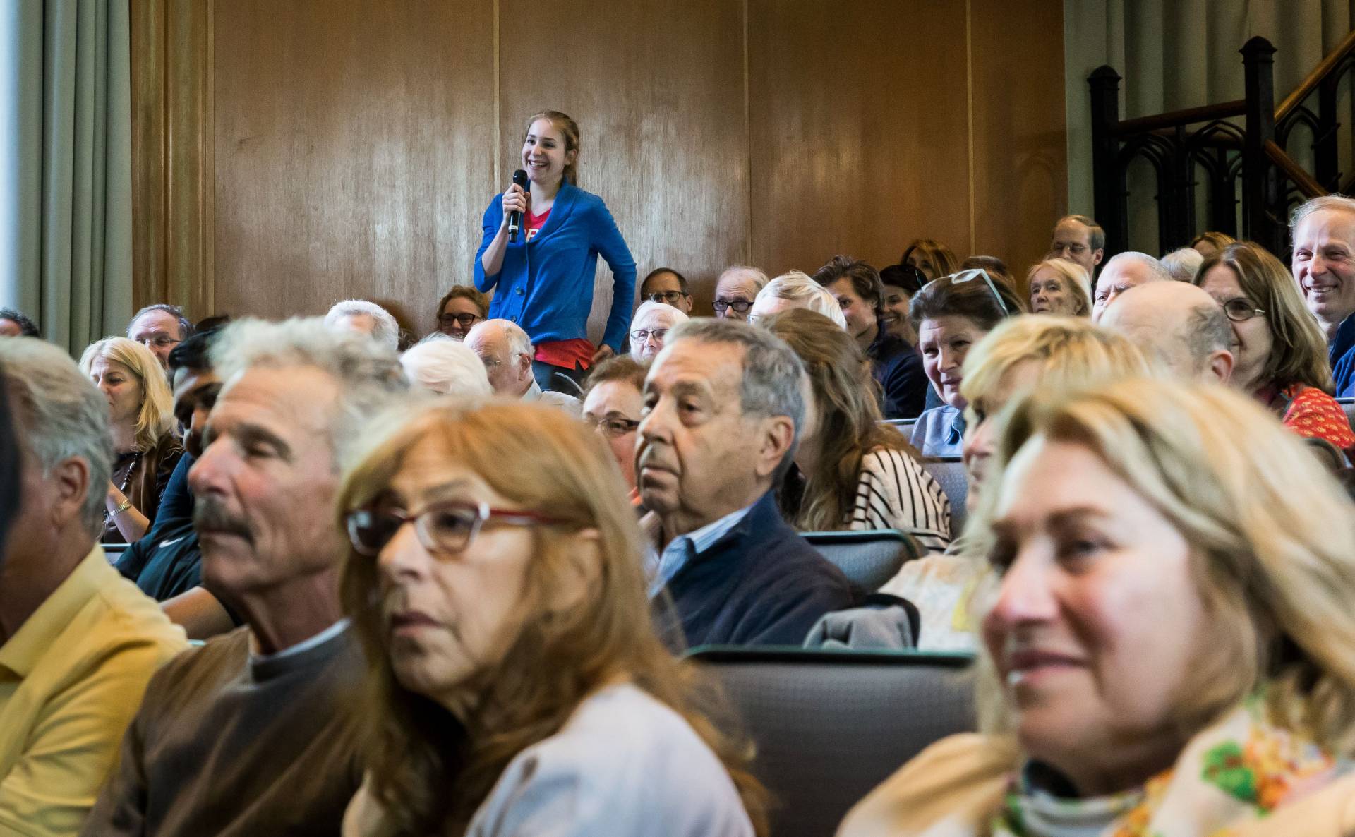 Student in audience asking question at James Baker lecture