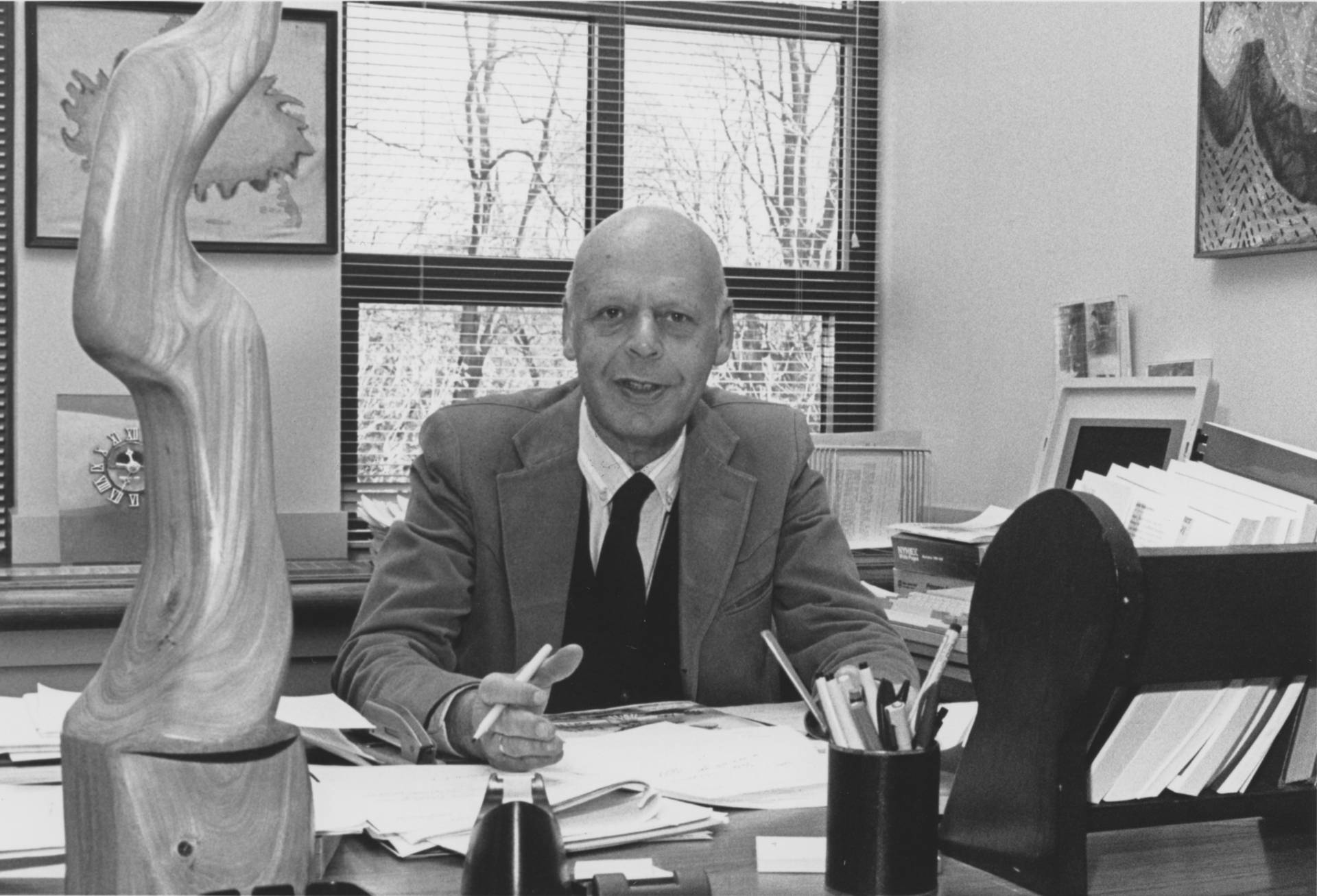 William Baumol at desk