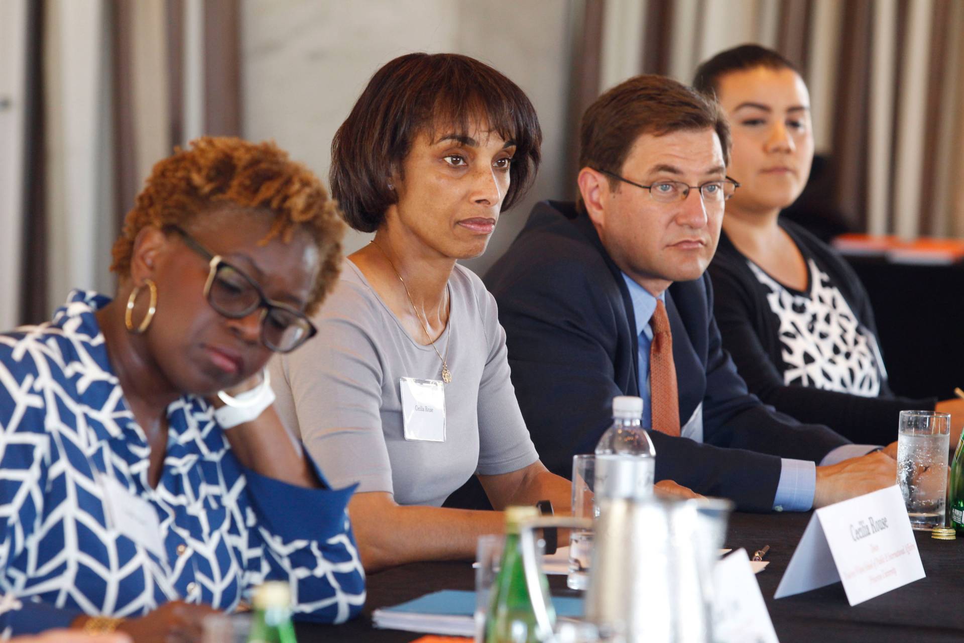 Cecilia Rouse sits at a table with others during a panel
