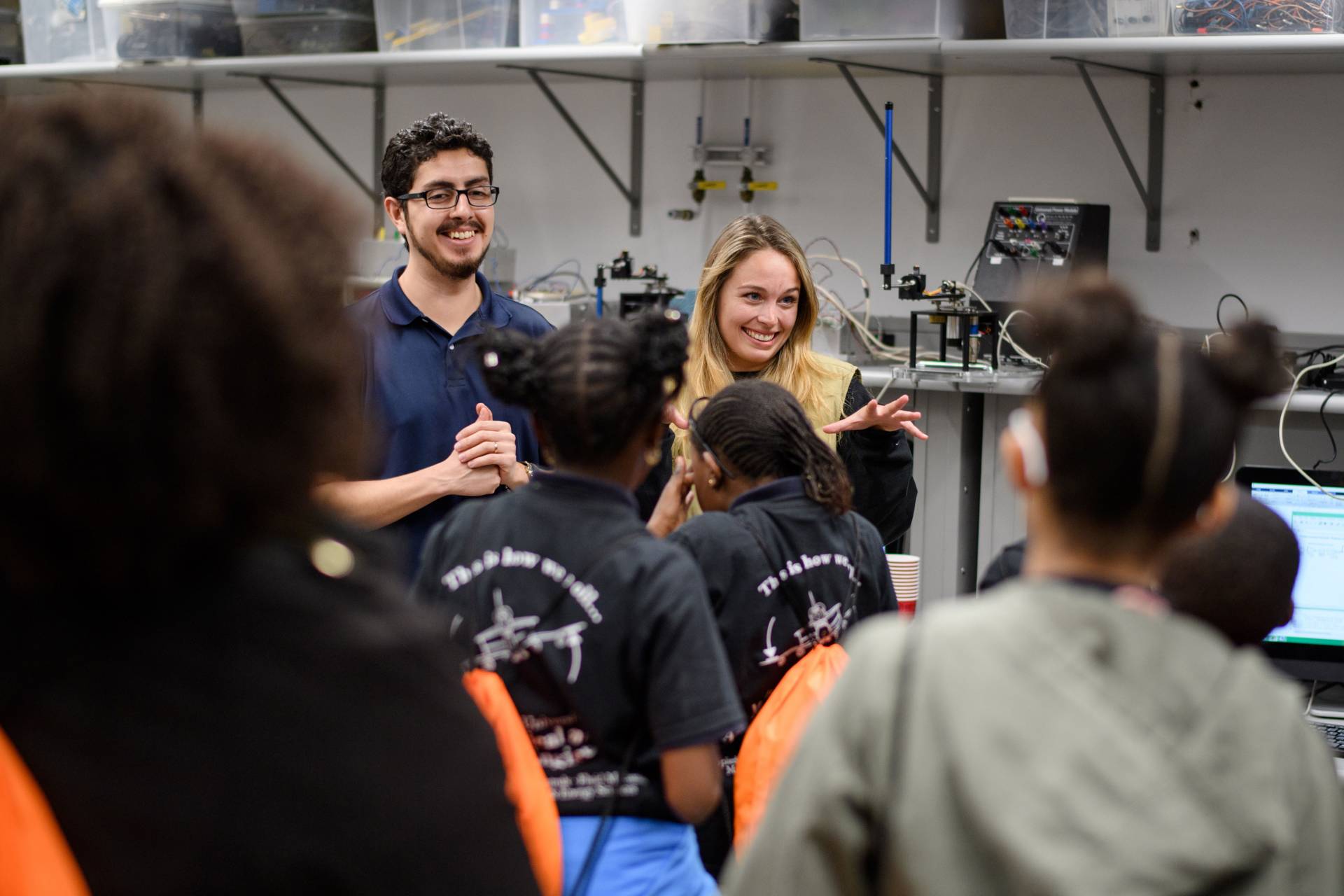 graduate students demonstrating to Harlem Prep students