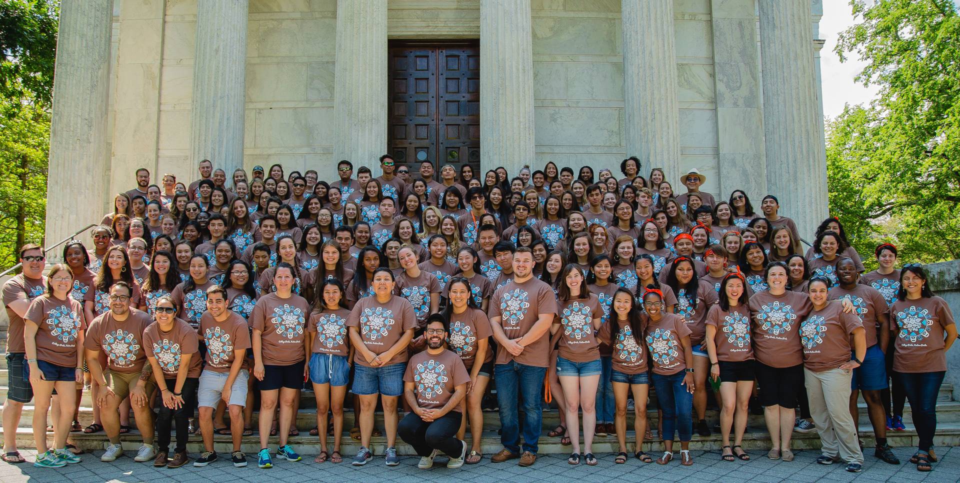 High school students pose in front of Clio Hall