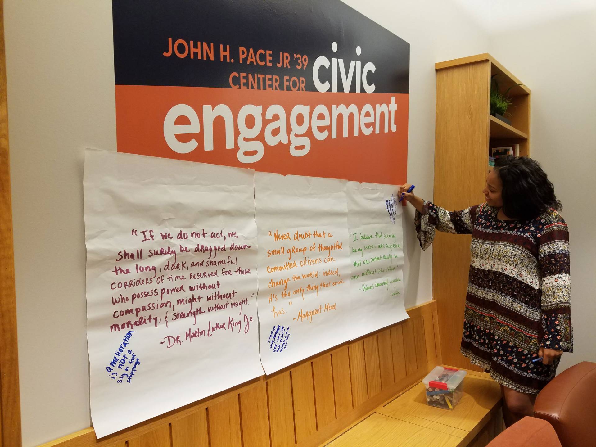 Mikaela Bankston writing on Pace Center wall