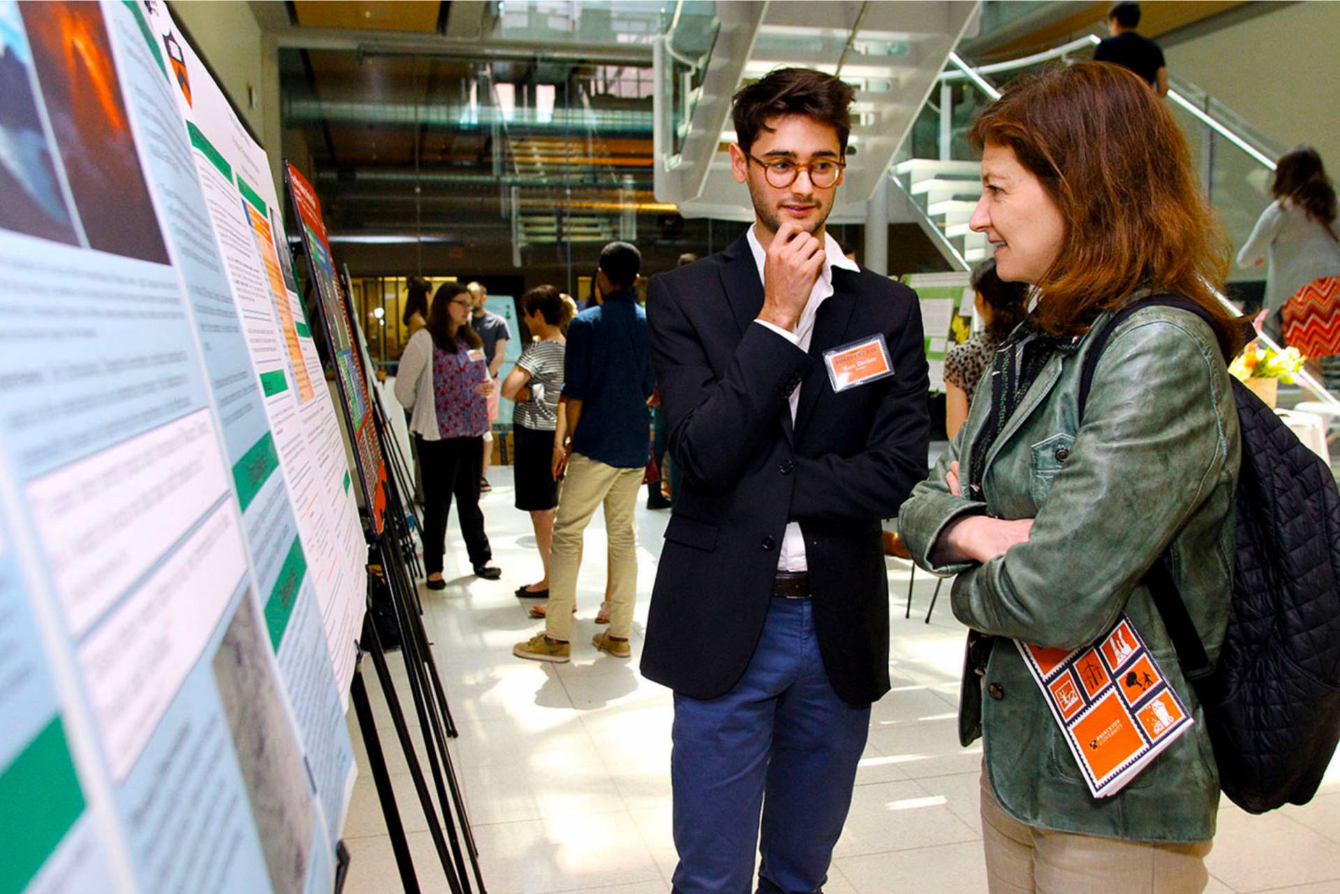 Marc Decitre explains his research to Princeton University Provost Deborah Prentice