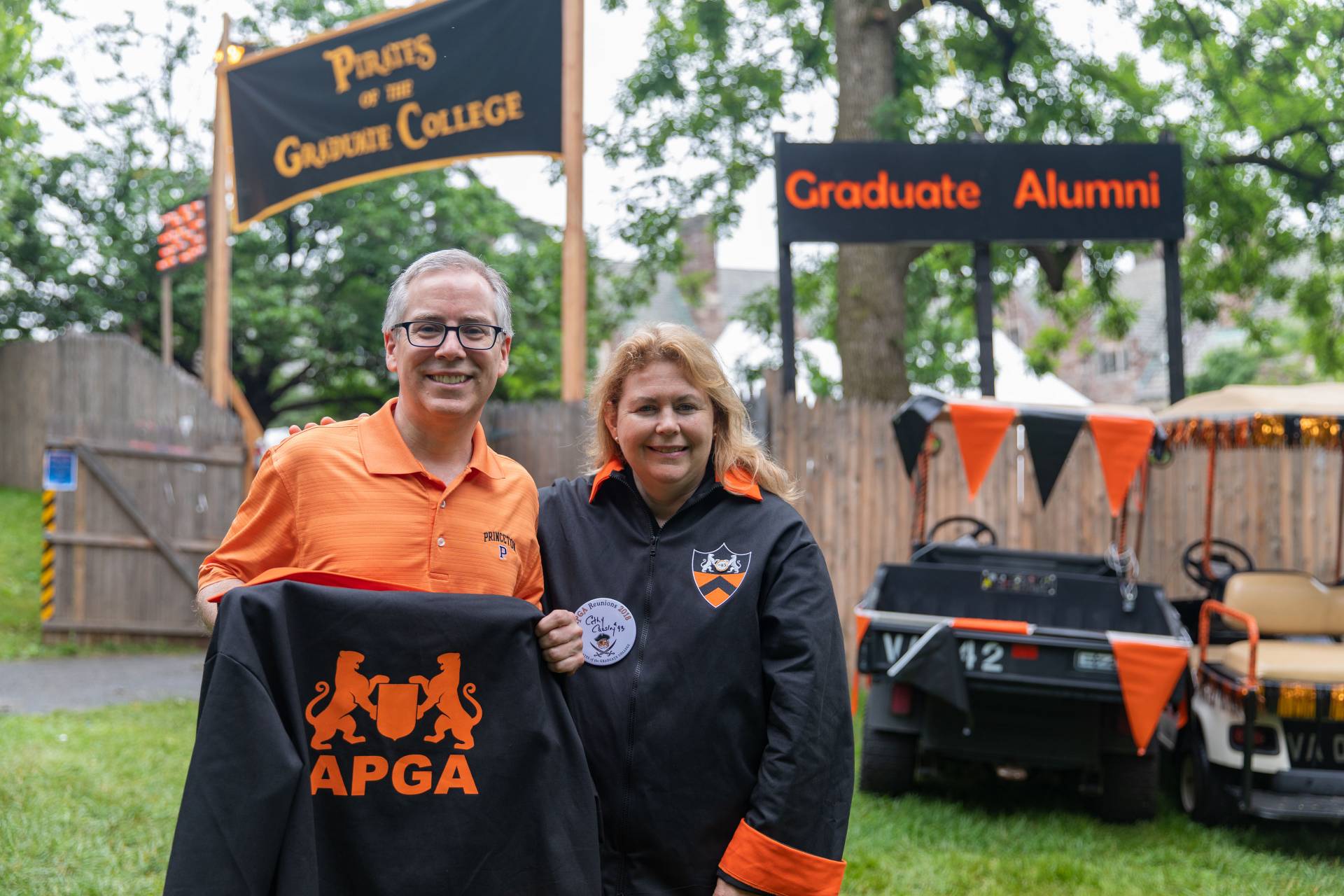 John Cuniff *88  and Cathy Carsley *93 standing outside Graduate Alumni reunion headquarters