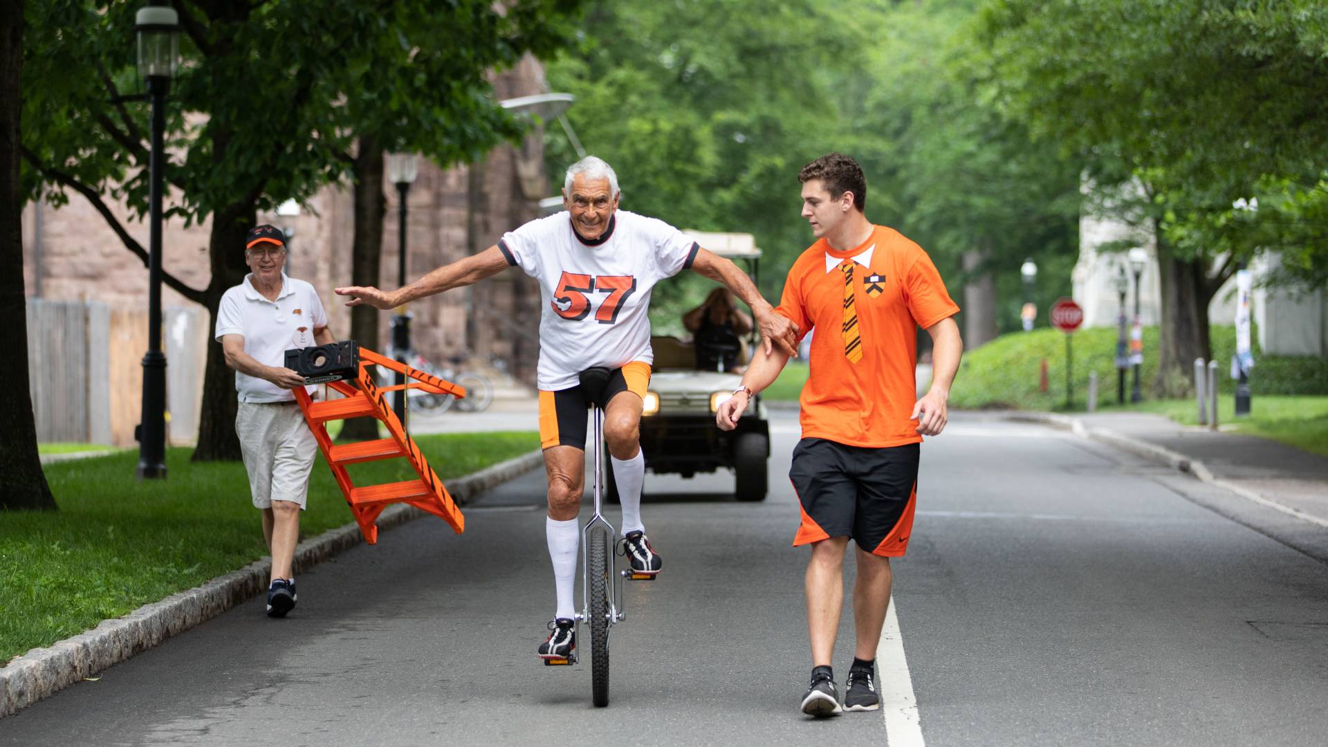 Dick Geyer '57 riding unicycle