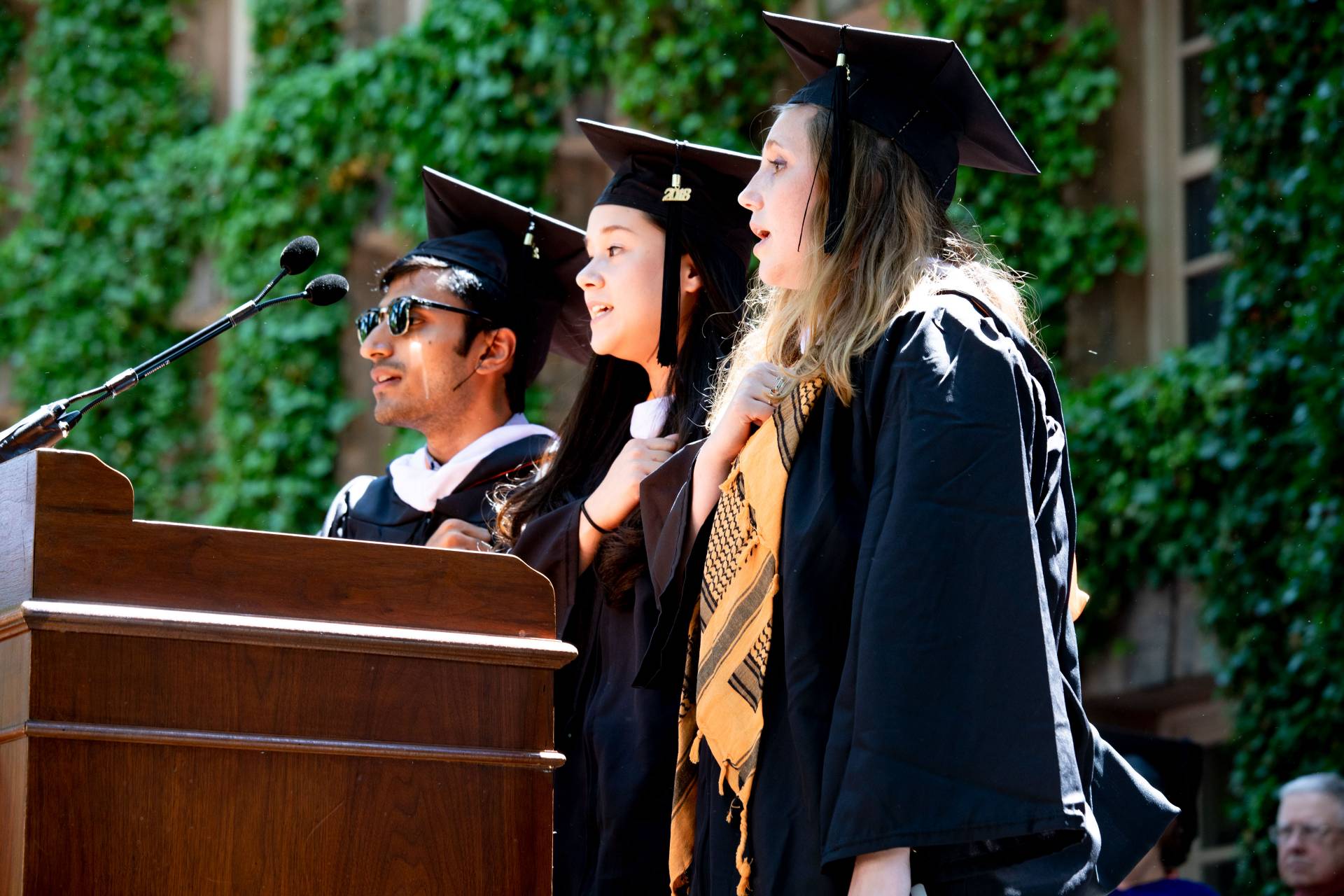 Shobhit Kumar, Beth Wang and Jennifer El-Fakir at podium