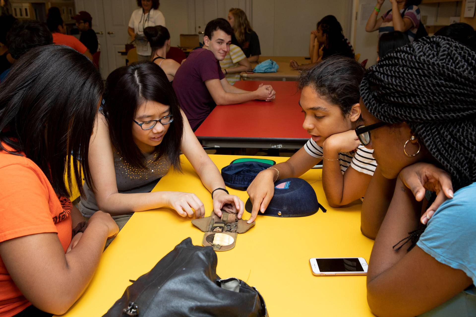 Students looking at a World War I-era shaving case