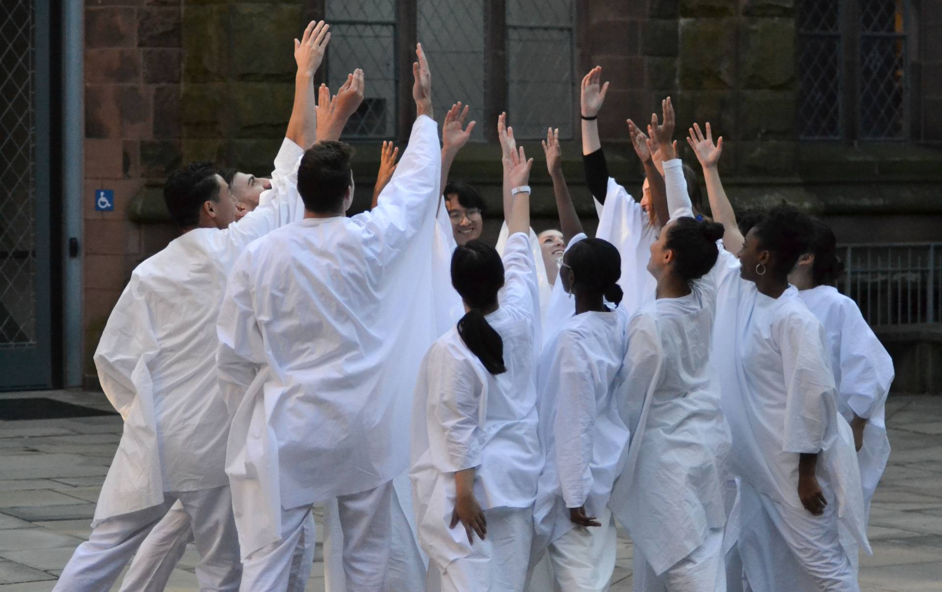 Students dancing near Johnson Arch