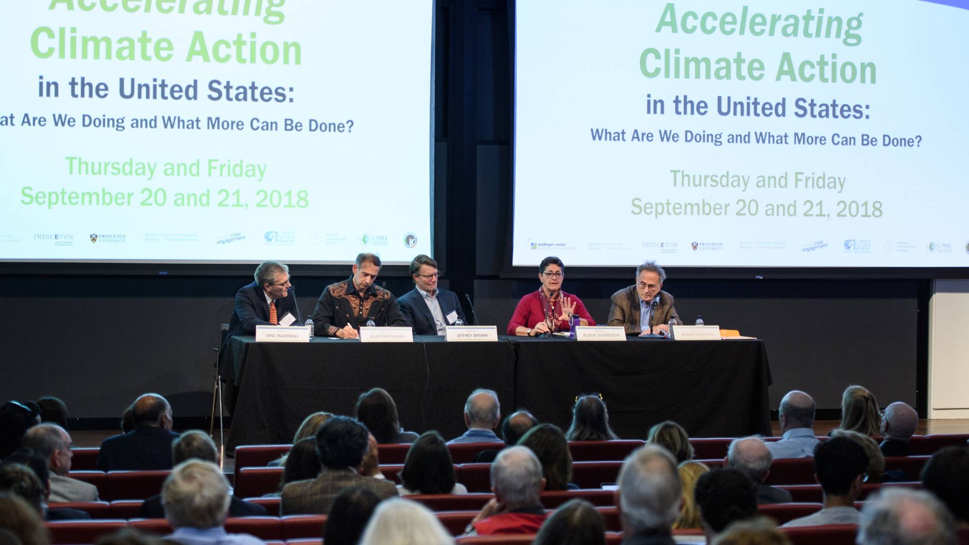 Panelists sitting on stage