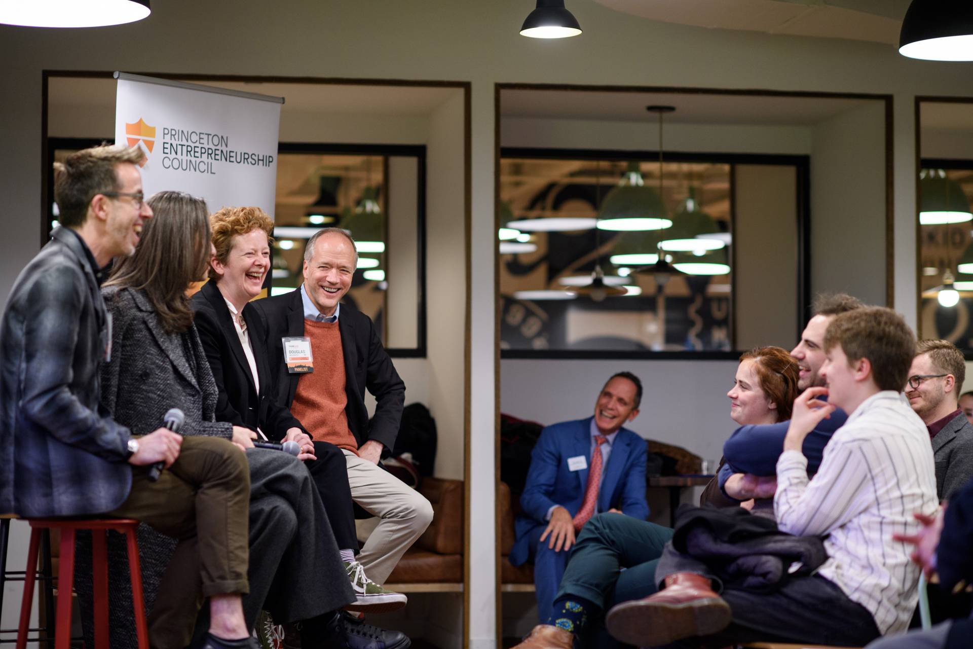 A panel, including Jane Cox, addressing an audience