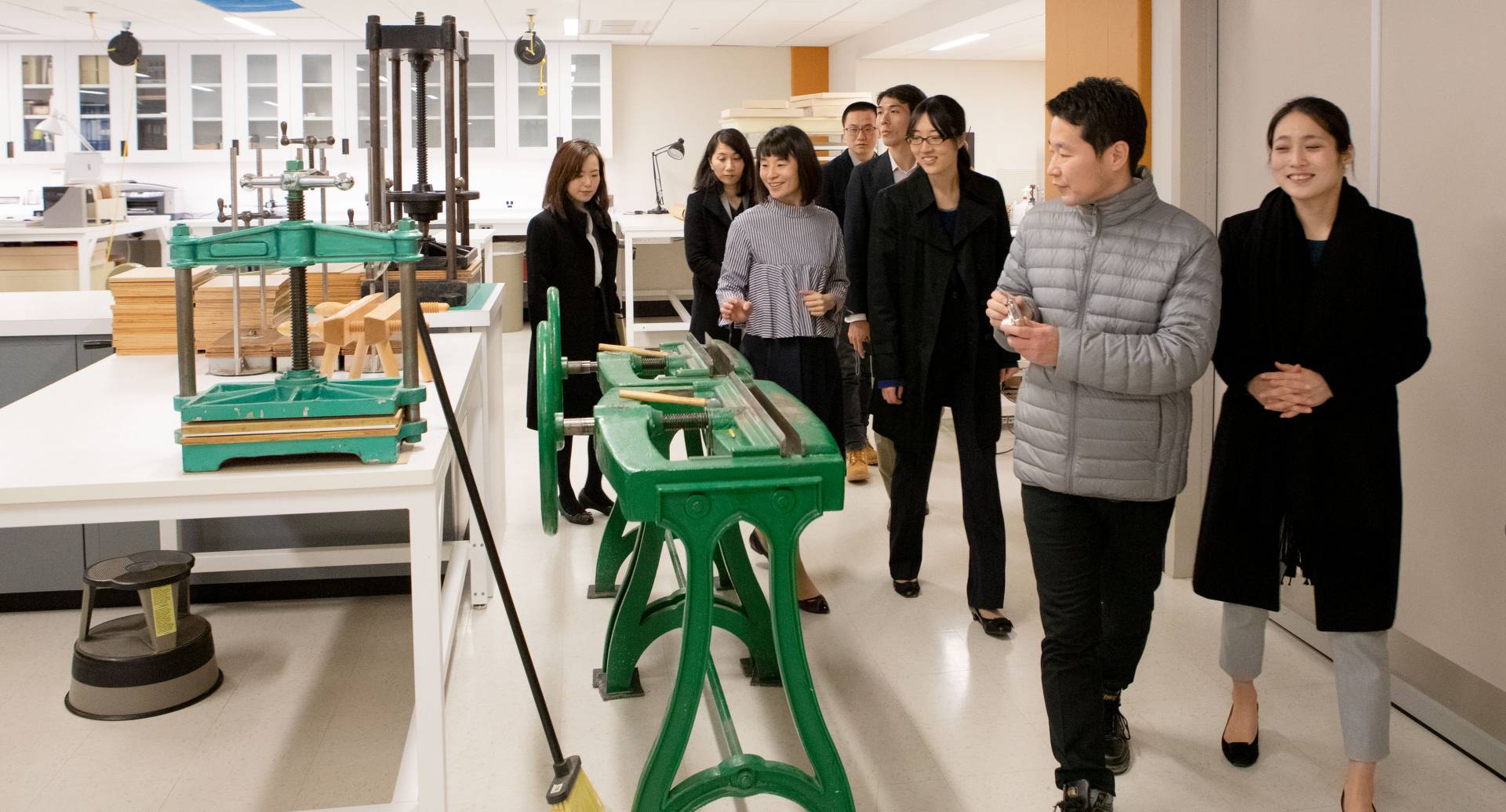 University of Tokyo delegates looking at machines in library