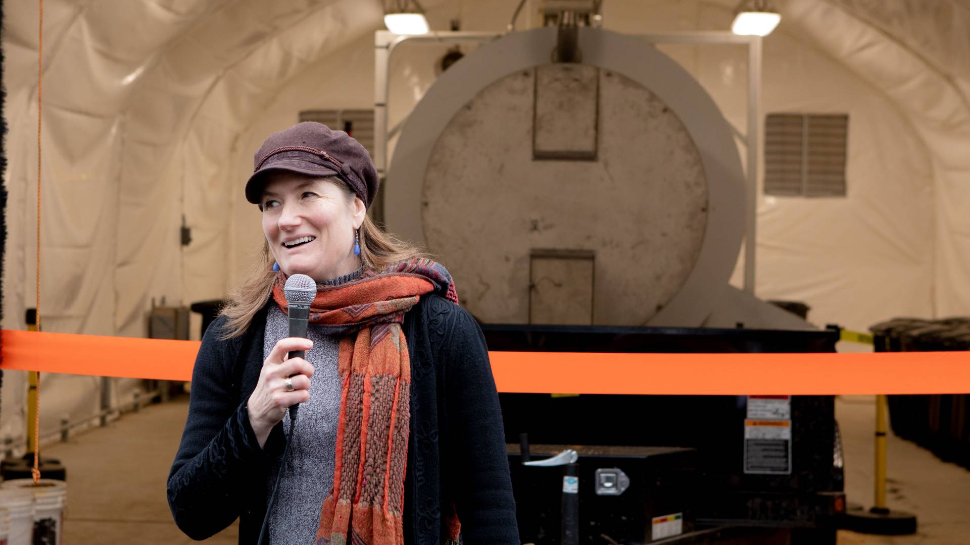 Shana Weber in front of biodigester