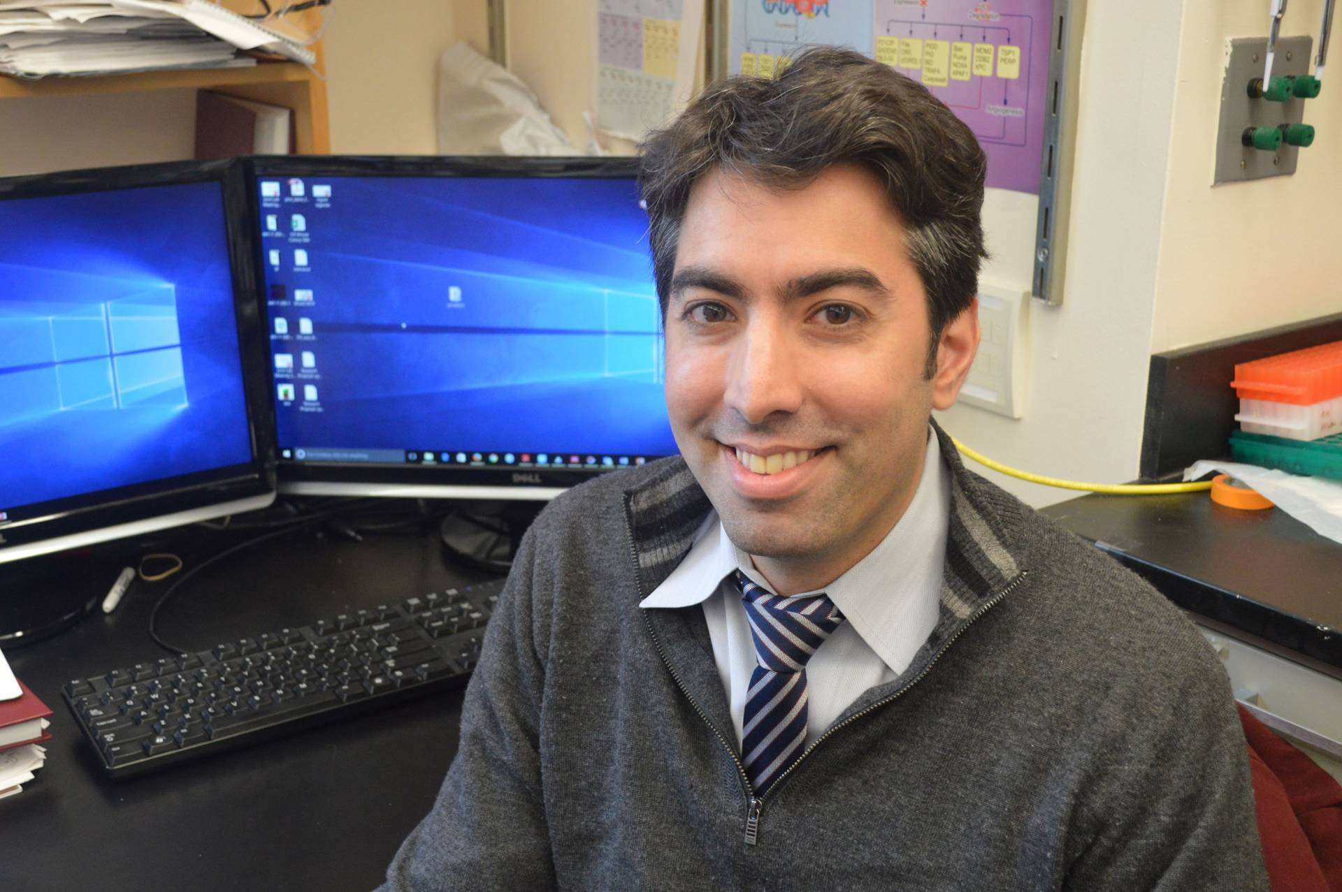 Nilay Sethi in front of computers