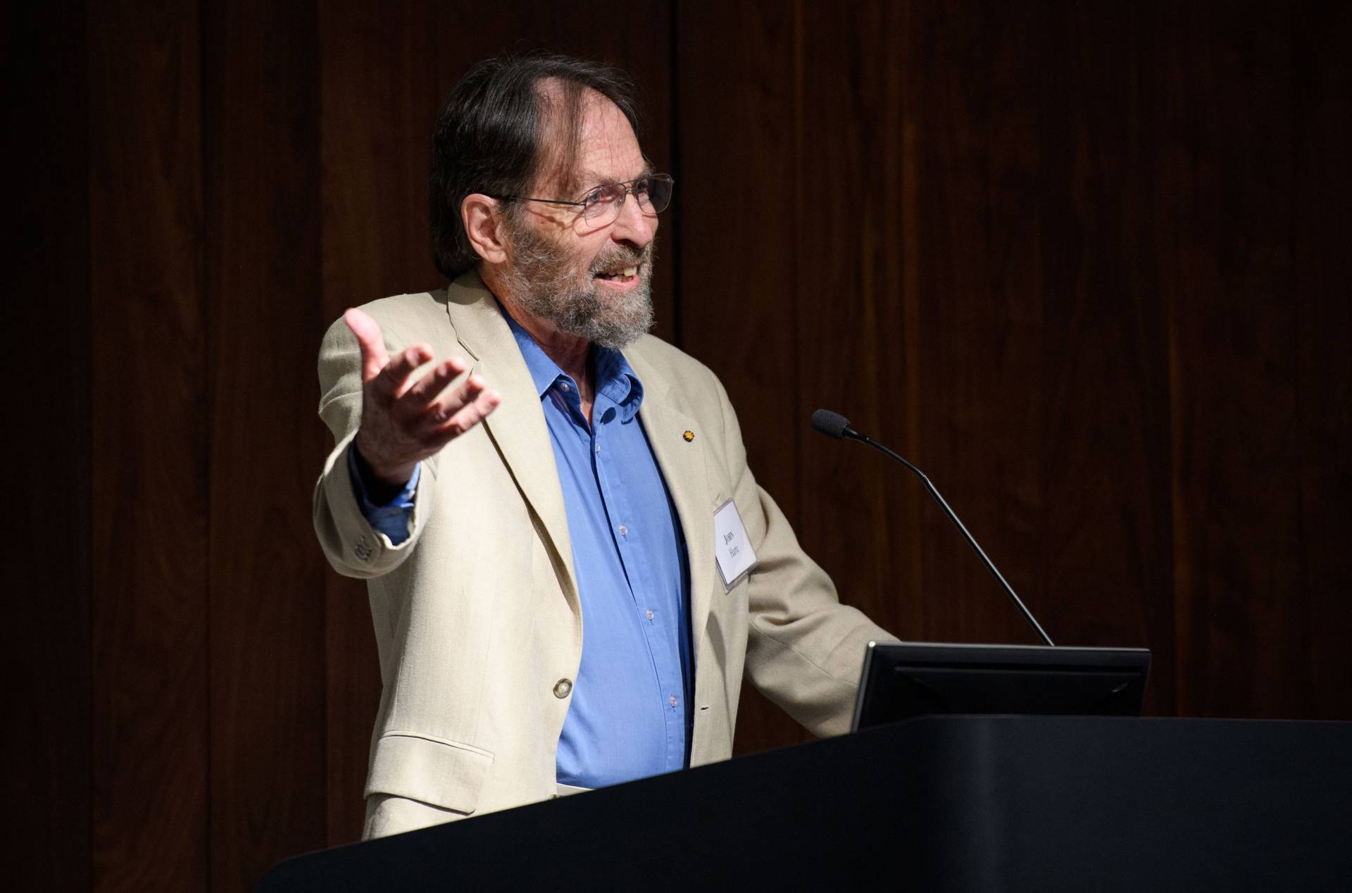 John Harte speaking at podium